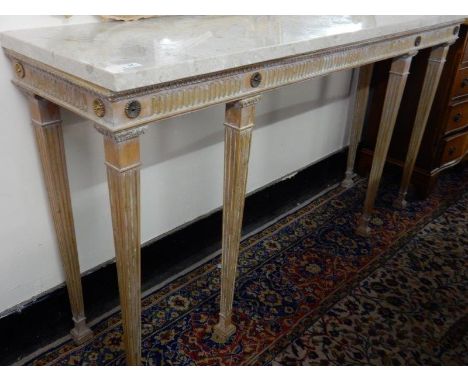 A limed oak and gilded console table with rectangular marble top, fluted frieze, on square legs and square feet