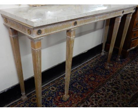 A limed oak and gilded console table with rectangular marble top, fluted frieze, on square legs and square feet