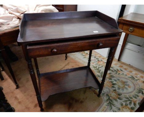 A mahogany washstand with 3/4 tray top, frieze drawer, on turned supports and shelf under