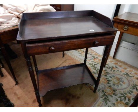 A mahogany washstand with 3/4 tray top, frieze drawer, on turned supports and shelf under