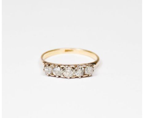 A lady's five stone diamond ring on an 18ct. gold shank