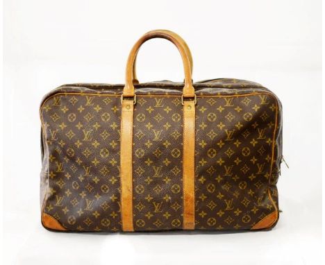 A vintage Louis Vuitton Sirius soft sided case in monogram canvas