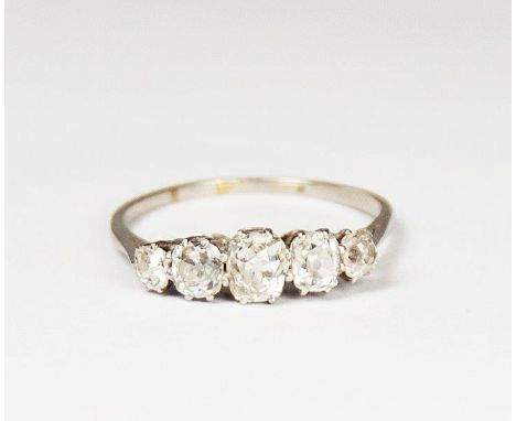 A lady's graduated five stone cushion cut diamond ring on a white metal shank