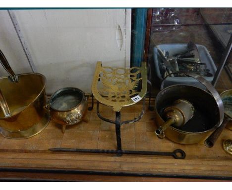 A selection of copper and brass including preserve pan, sauce pans, cauldrons, trivet, candlestick, bucket, poker etc..