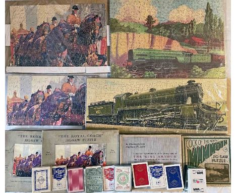 Misc railway-related items comprising 4 JIGSAWS and 12 packs of PLAYING CARDS. The jigsaws, all complete, assembled and with 