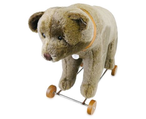 A Steiff limited edition bear on wheels, with growler mechanism No.832/1500 with certificate, 43cm high, in original box with