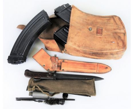 A Kalashnikov AK47, stitched leather magazine case with three (ex.4) empty magazines, together with a bayonet in leather scab