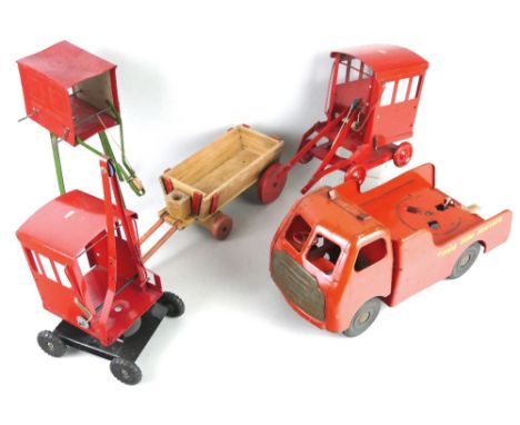 Two Tri-ang tin-plate cranes, 34cm high, another tin-plate crane marked Golden Gate Crane Co., 31cm high, a Tri-ang Fire Serv