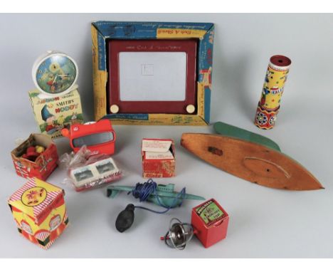 A Smiths Noddy alarm clock, 12cm high, boxed, an Acme tin-plate kaleidoscope 21cm high, a boxed Etch-a-Sketch, a Bowman pond 