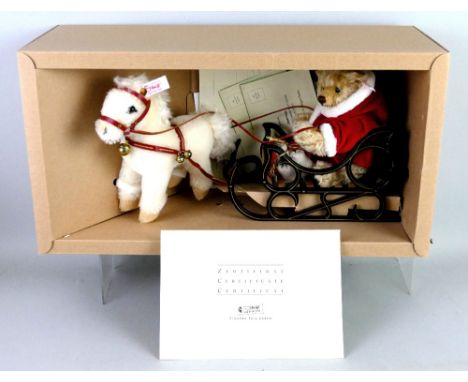 A Steiff limited edition Father Christmas bear, on metal sleigh with pony, No.1356/4000 with certificate, 40cm long in origin