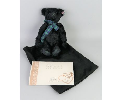 A Steiff limited edition Black Watch musical teddy bear, 30cm high, No.1599/2000, in bag with certificate, EAN 662386