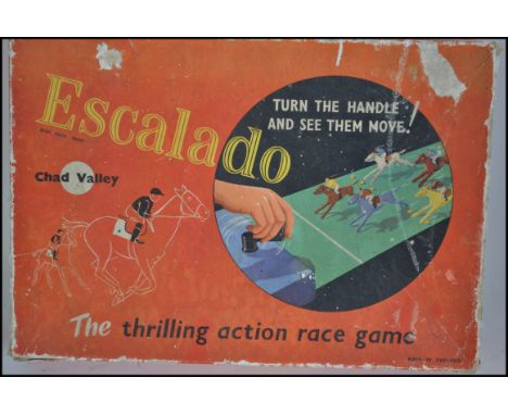 An original vintage Chad Valley made Escalado table top horse racing game, complete, with all horses in lead. Original box.