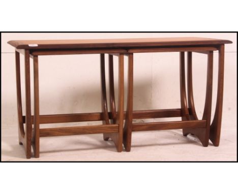 A vintage G-PLAN teak coffee table trio set .  Long main table with two small occasional's to underside with solid teak atomi