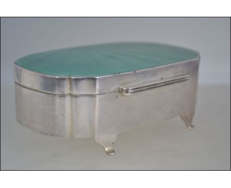 A very good silver casket with engine turned enamel hinged lid in green . Hallmarked Birmingham 1934 makers : DM co , approx 