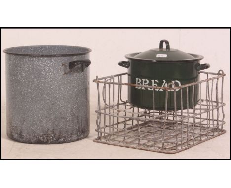 A vintage metal milk crate, circa mid 20th century together with a mid century enamel and metal bread bin and another 35cm hi
