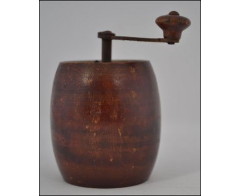 A rare mid 19th century treen pepper mill / grinder in the form of a barrel with handle to top driving mechanism at base H8cm