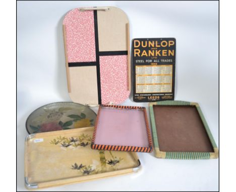 A collection of vintage retro trays to include 2 rattan examples, a multi coloured mid century example. Also a Dunlop Ranken 
