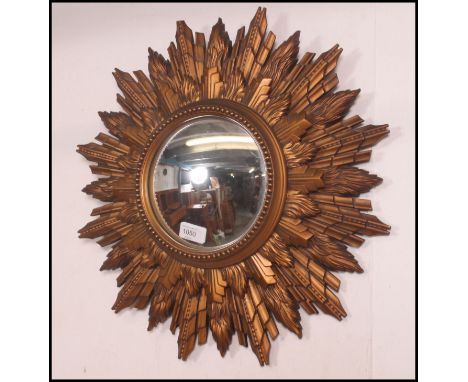 A stunning vintage retro 1950's French Sunburst convex wall mirror. The gilt frame containing a circular convex mirror 50cm h
