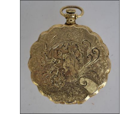 An early to mid 20th century ladies gilt hinged compact having a decorative rococo finish W6cm
