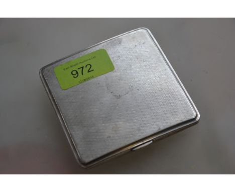 A silver hallmarked cigarette case having an engine turned geometric pattern, assay marks for London dating to 1933 and maker