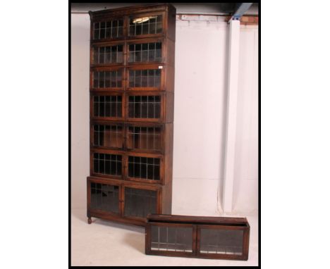 An Edwardian large Globe Wernicke style oak and leaded glass eight section tall stacking lawyers / barristers bookcase. Raise