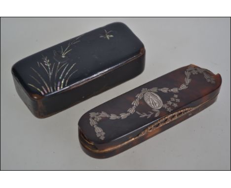 Two 19th century snuff boxes the first being constructed from paper mache with mother of pearl inlay and the other being tort