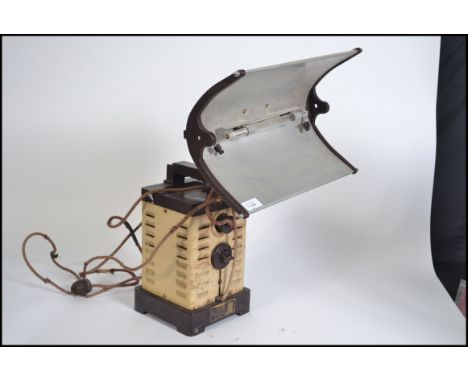 A vintage / retro mid century heat lamp by Home Sun, constructed from tin and bakelite having a square base with dial to fron
