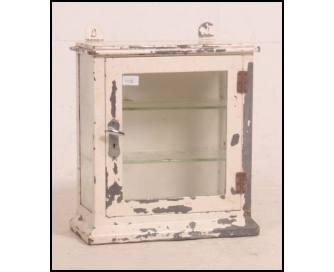 A good vintage glass advertising / shop display countertop cabinet, white painted, with glazed front and glass shelves within