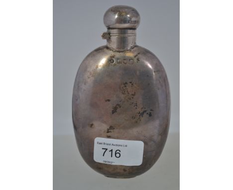 A silver hallmarked hip flask of lozenge form being hallmarked for London 1909, weight 120.7g