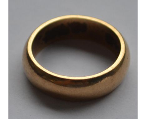 A 9ct gold hallmarked band ring, The interior marked for Birmingam. Maker H,G&S, Weight  5.1g - Size K.5