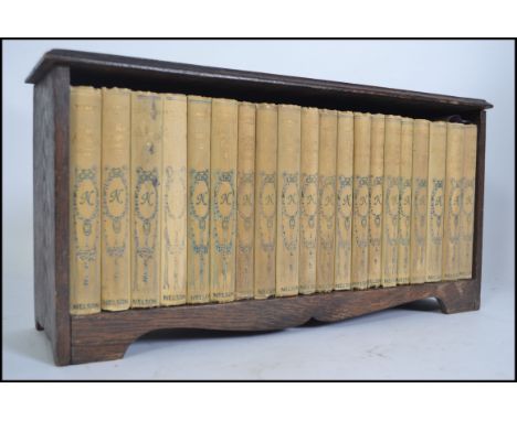 A collection of 20x vintage (date unknown) classic French novels, all published by Nelson, within an oak display cabinet. Eac