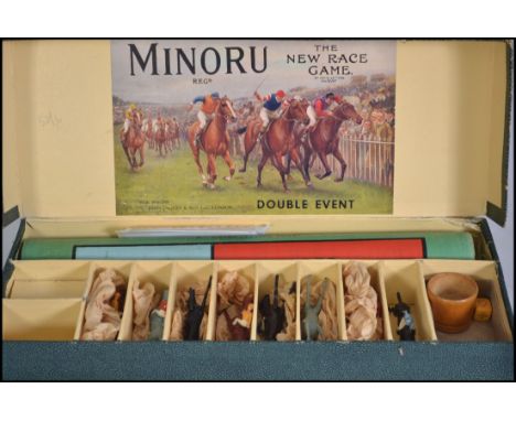 A vintage boxed The New Race Game Minoru appears to be complete with instructions