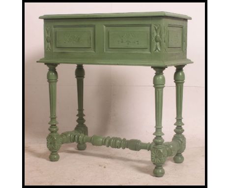 An unusual 19th painted oak French planter. Of tall form with carved legs united by stretchers having a carved top with inset