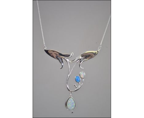 A silver art nouveau style opal set necklace