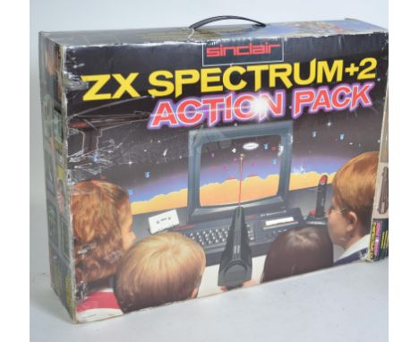 VINTAGE GAMING: A collection of vintage games and consoles to include a boxed ZX Spectrum +2 Action Pack, Commodore 64, vario