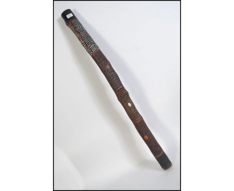 A traditional mid 20th century Aboriginal / Australian  didgeridoo with painted animal and geometric decoration