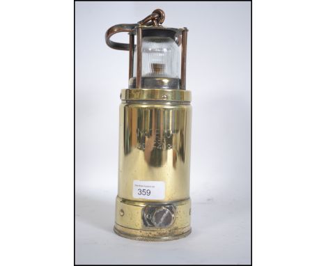 A vintage brass safety  brass and copper submarine safety lamps, inscribed McGeoch, 0583 900 - 4090 H27cm