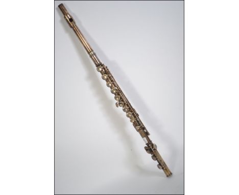 A 20th century Chinese made chrome flute with mother of pearl buttons makers name engraved on the flute