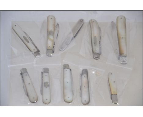 A collection of 10 silver hallmarked fruit knives - pen knives. Most with mother of pearl handles, some with plain silver car
