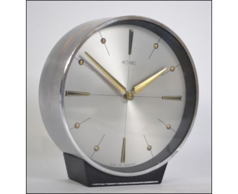 A Metamec retro vintage mantle clock , turn wind mechanism , good example with atomic brushed dial / face and golden coloured