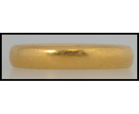 A 22ct hallmarked band ring size K, assay stamp for Birmingham with a total weight of 5.8g