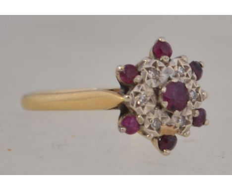 A good 18ct gold ruby and diamond cluster ring, the diamonds approx 8-10 pnts with ruby surround. Birmingham hallmarks date l