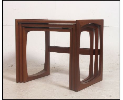 A vintage 20th century Danish influence G-Plan Kelso teak wood nest of tables, each table of graduating form, with applied G 