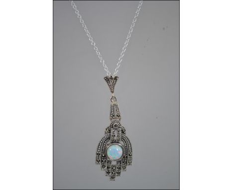 A silver and marcasite art deco style necklace with central opal