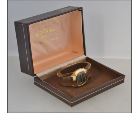 A retro boxed Rotary Quartz LCD Digital watch in a gold finish, retaining the original instructions and guarantee booklet and