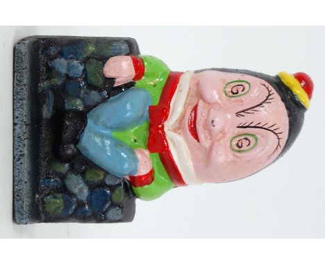 A vintage style cast iron hand painted money box in the form of Humpty Dumpty. 14cm tall. 