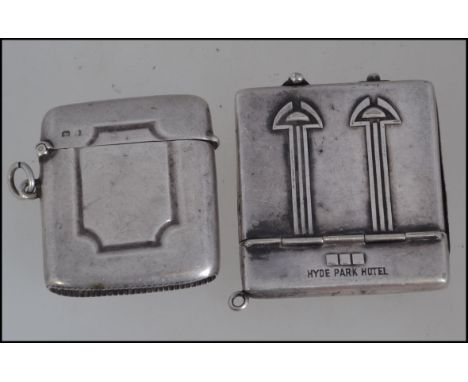 A vintage silver metal advertising match book holder for Hyde Park Hotel along with a silver hallmarked match vesta with assa