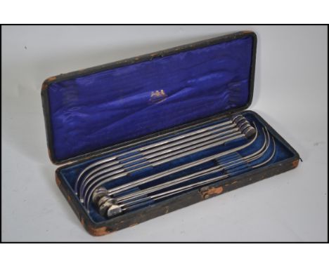 A cased set  of unusual steel graduating medical tools in the original case with makers name to inner