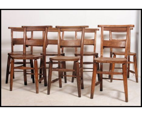 A  set of 7 x  19th century country beech wood chapel chairs raised on turned legs with prayer shelf top rests. 82cm high x 4