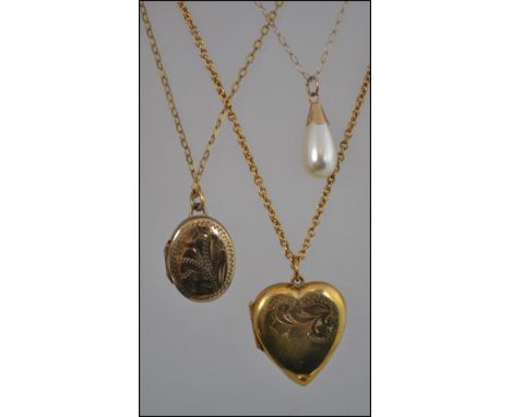 A collection of three 9ct gold necklaces to include two with lockets and the other having a drop pearl pendant